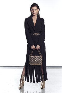 Full-Body Fashion Editorial with Fringe Dress and Gold Accessories