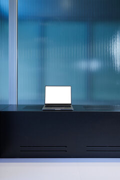 Laptop on Sideboard