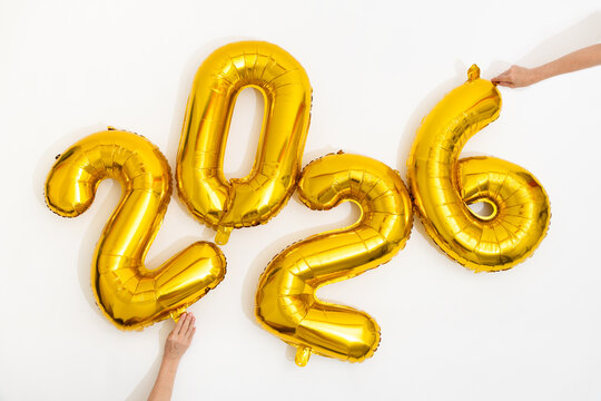 Celebration With Golden Balloons and Confetti for New Year 2026