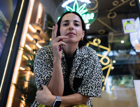 Woman smoking outside dispensary