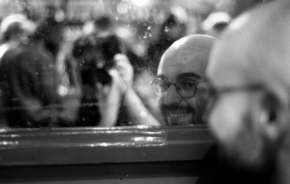 Reflection of a man in a mirror's cafe, Paris