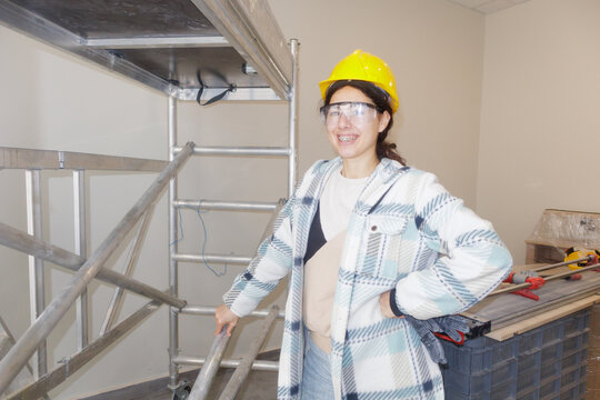 Portrait of a young woman at a construction site