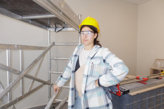 Portrait of a young woman at a construction site