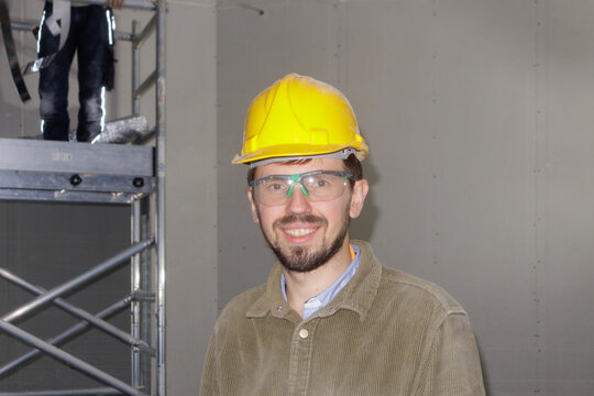 Portrait of a young man at a construction site