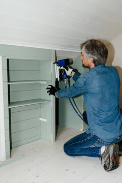 Man using nail gun for home renovation