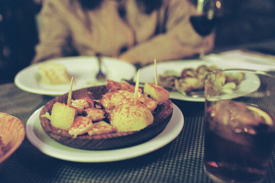 Tapas Served in a Cozy Outdoor Restaurant During the Evening