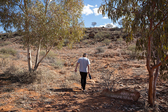 Man's hiking in outback Australia looking at the view. Travel concept.