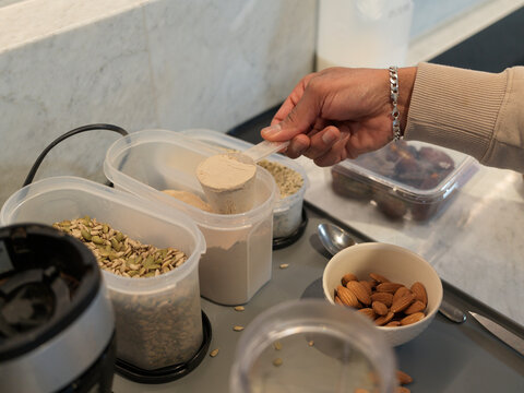 Preparing a Healthy Smoothie With Seeds and Nuts in the Kitchen