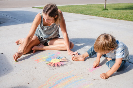 Mother And Son Sidewalk Chalk