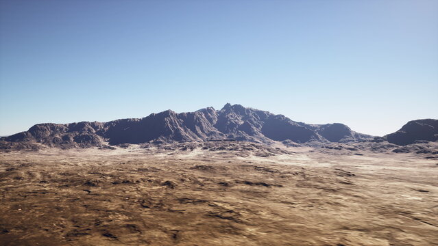 arid desert plain under clear sky stretches toward jagged mountain ridge sun casts sharp shadows across cracked soil and scattered gravel scene evokes