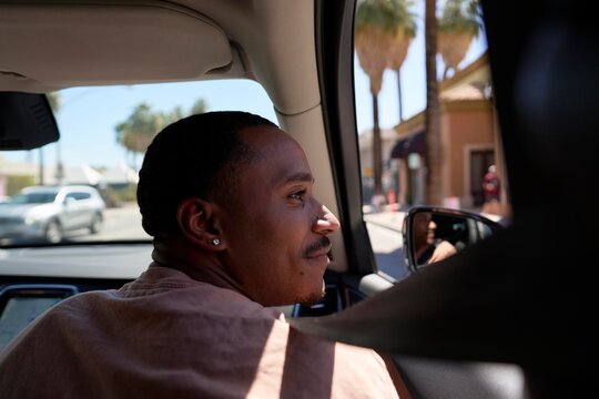 Man Enjoying a Summer Drive Through a Sunny SoCal Neighborhood