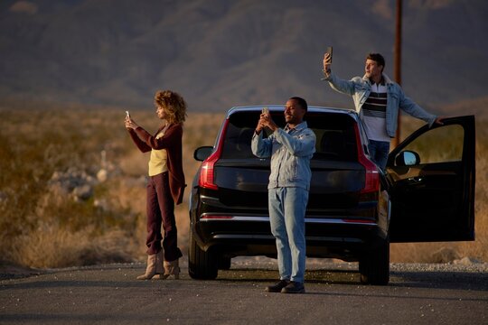 Friends capture moments during desert sunset getaway