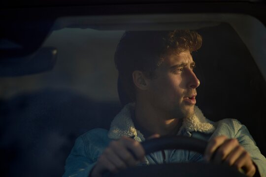 Driver enjoying the view during a calm evening drive