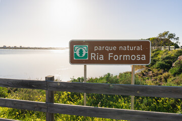 Ria Formosa Natural Park entrance sign by lagoon