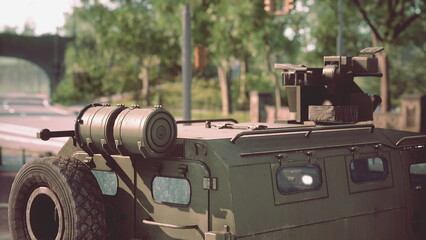 A military vehicle stands on a city street under clear blue skies. © icetray