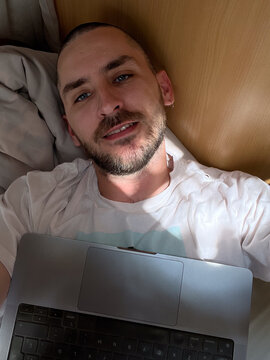 Person Relaxing with a Laptop