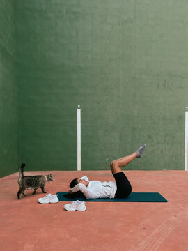 Outdoor Yoga Exercise With a Cat
