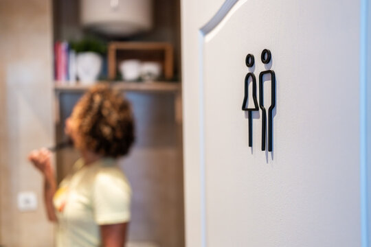 Restroom sign indicating male and female toilets