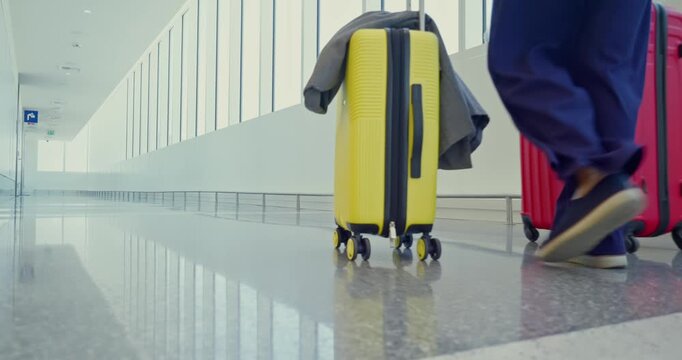 Traveler Walking with Luggage in Bright Airport Corridor