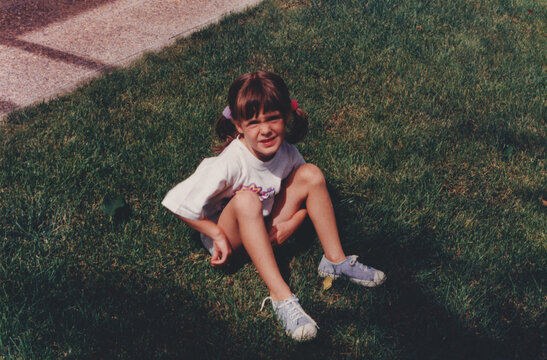 Girl Sitting on Grass