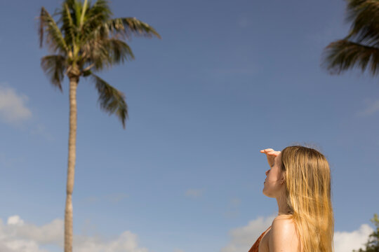 Girl looking into the distance at the beach