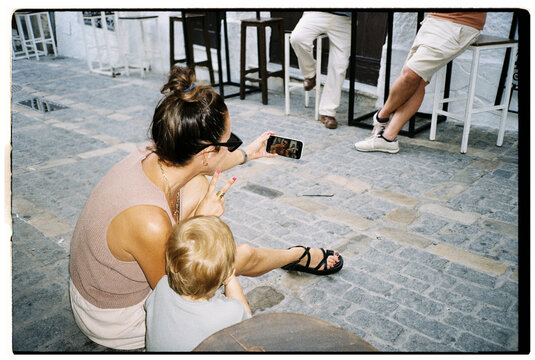 Woman Taking Selfie with Son