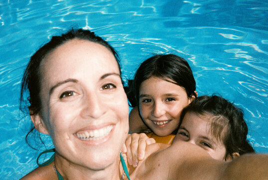 Happy Family Swimming in Pool. Summer holidays film