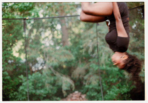 Girl jumping upside down