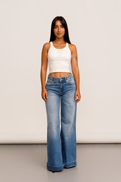 Model Poses in Casual Outfit Showcasing Wide-Leg Jeans 