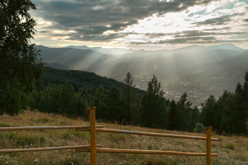 Fototapeta premium Sun Rays Over Mountain Valley at Sunset