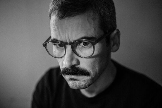 Serious Man Staring with Intensity and Purpose

