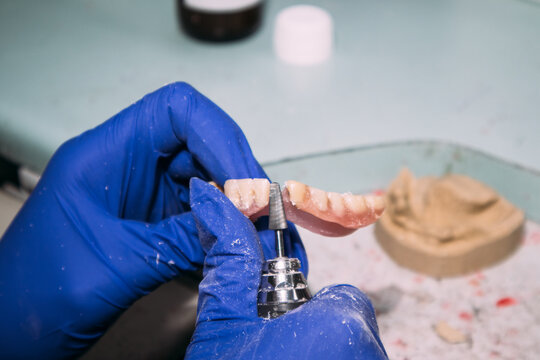 Finishing denture with rotary tool