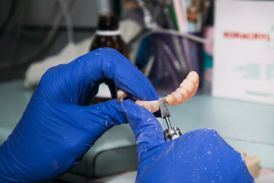 Finishing denture with rotary tool