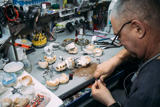 Dental technician working with crowns