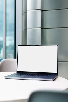 Laptop Mockup with White Blank Screen on Office Table