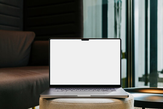 Laptop Mockup with White Screen in Lounge Setting