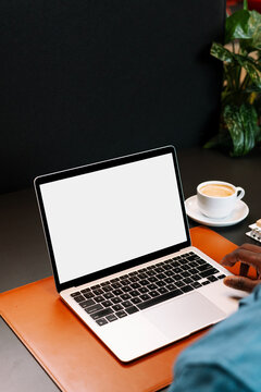 MAn Using Laptop with White Screen Mockup