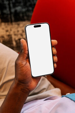 Hand Holding Smartphone with White Screen Mockup