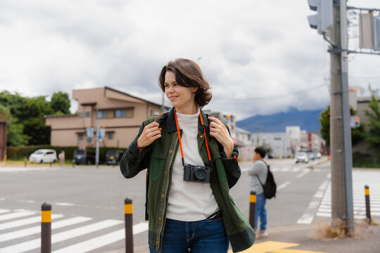 A tourist walks through the city