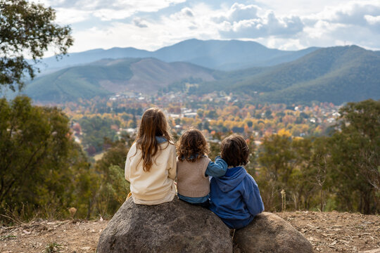 Siblings sitting down overlooking Bright