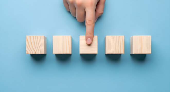 Choosing the right option represented by hand selecting a wooden cube block