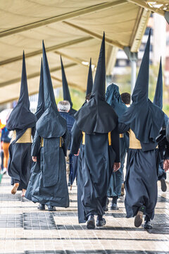 Seville Holy Week Nazarenos Penitents Walk to Church Procession