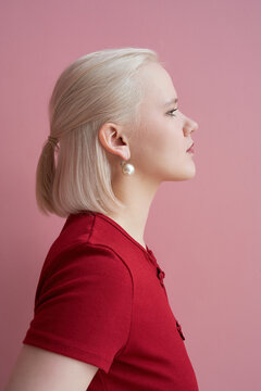 Woman with platinum blonde hair and earrings