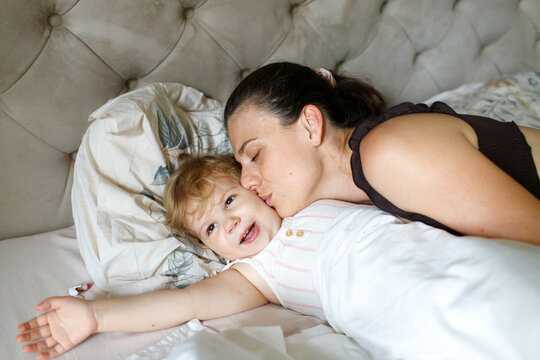 pregnant mother and child spending time at home