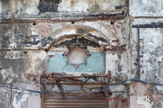 9 Nine Pointed Star on the Facade of a Crumbling Abandoned Stone Building in Mumbai, India