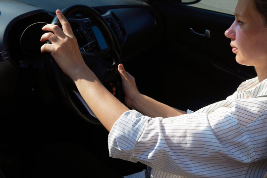 Woman driver focused on navigating the road ahead