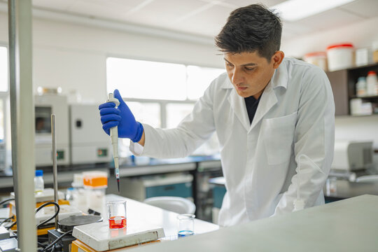 Pipetting solution into beaker