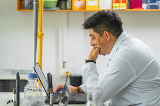 Scientist focused on laptop