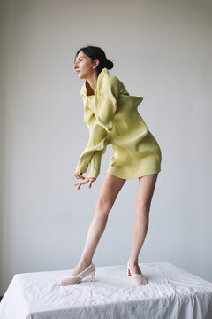 Woman in creative dress full body fashion portrait