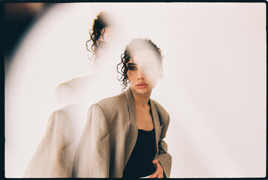 Queer man  posing with double exposure effect